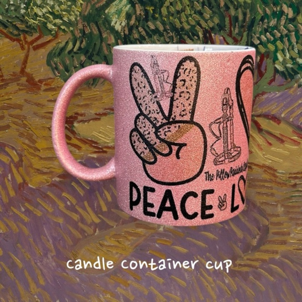 Container Mug candle scented with charms in pink glitter cup.
